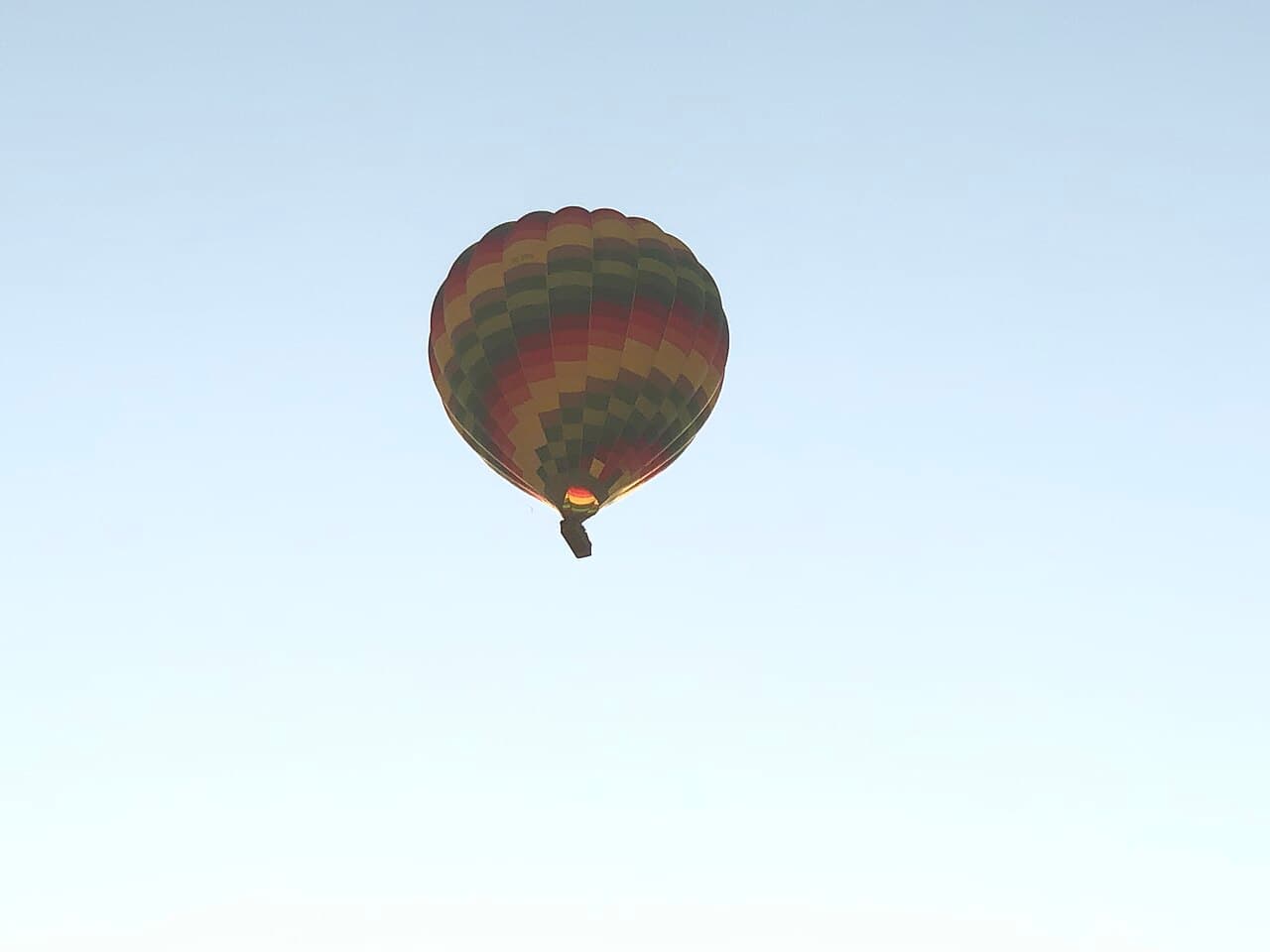 A hot air balloon in flight over Luxor