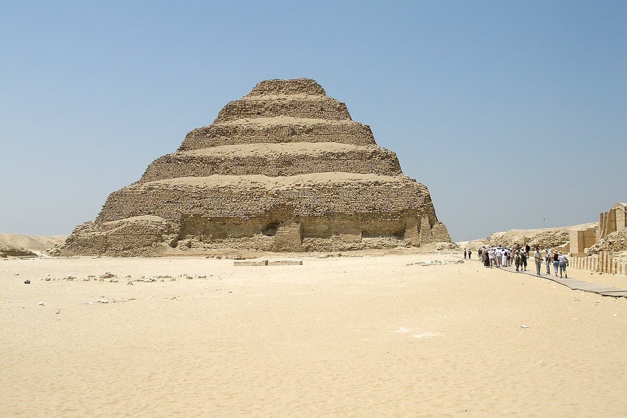 Visitors walking near the Step Pyramid of Djoser at Saqqara
