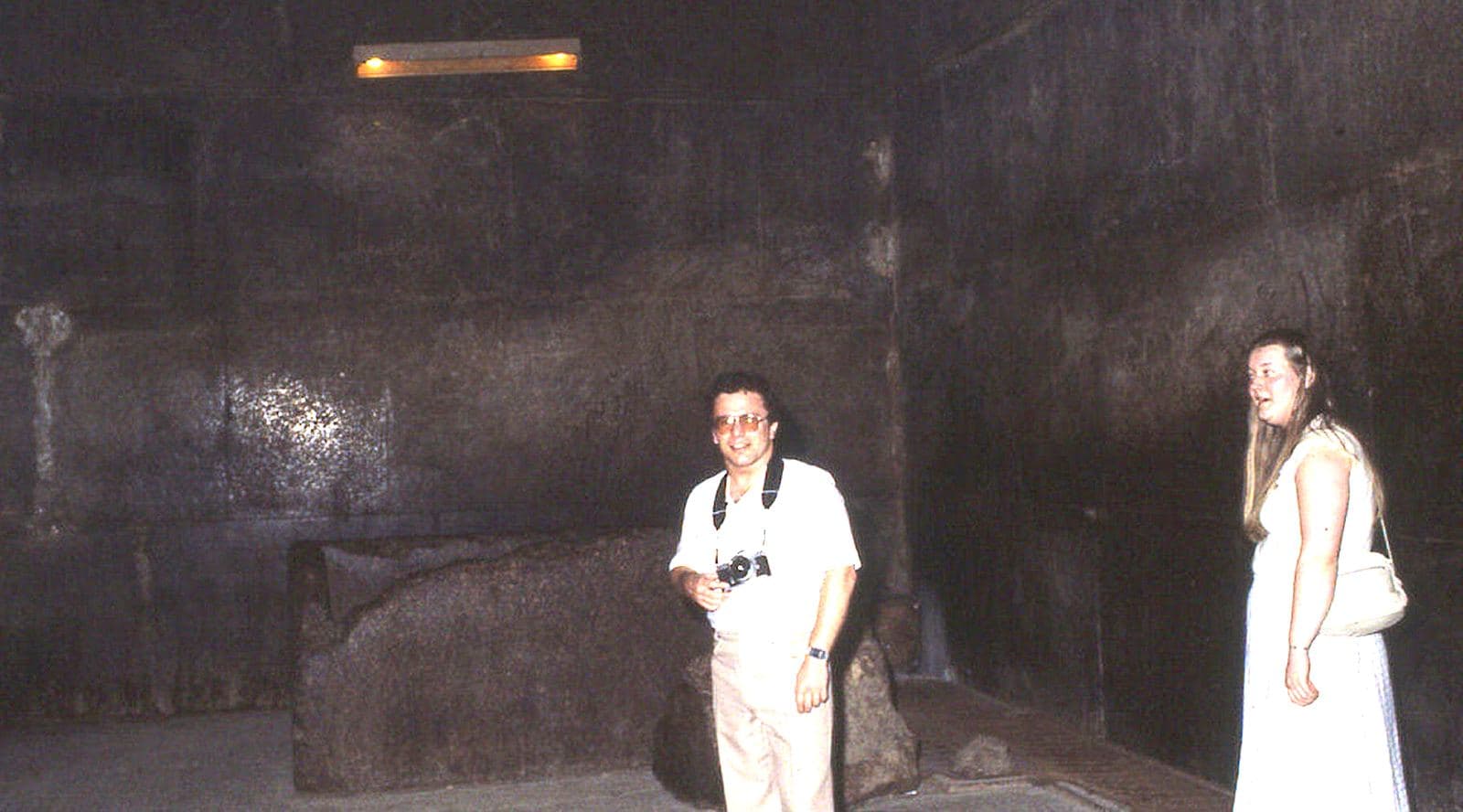 Travelers exploring a chamber inside the Great Pyramid