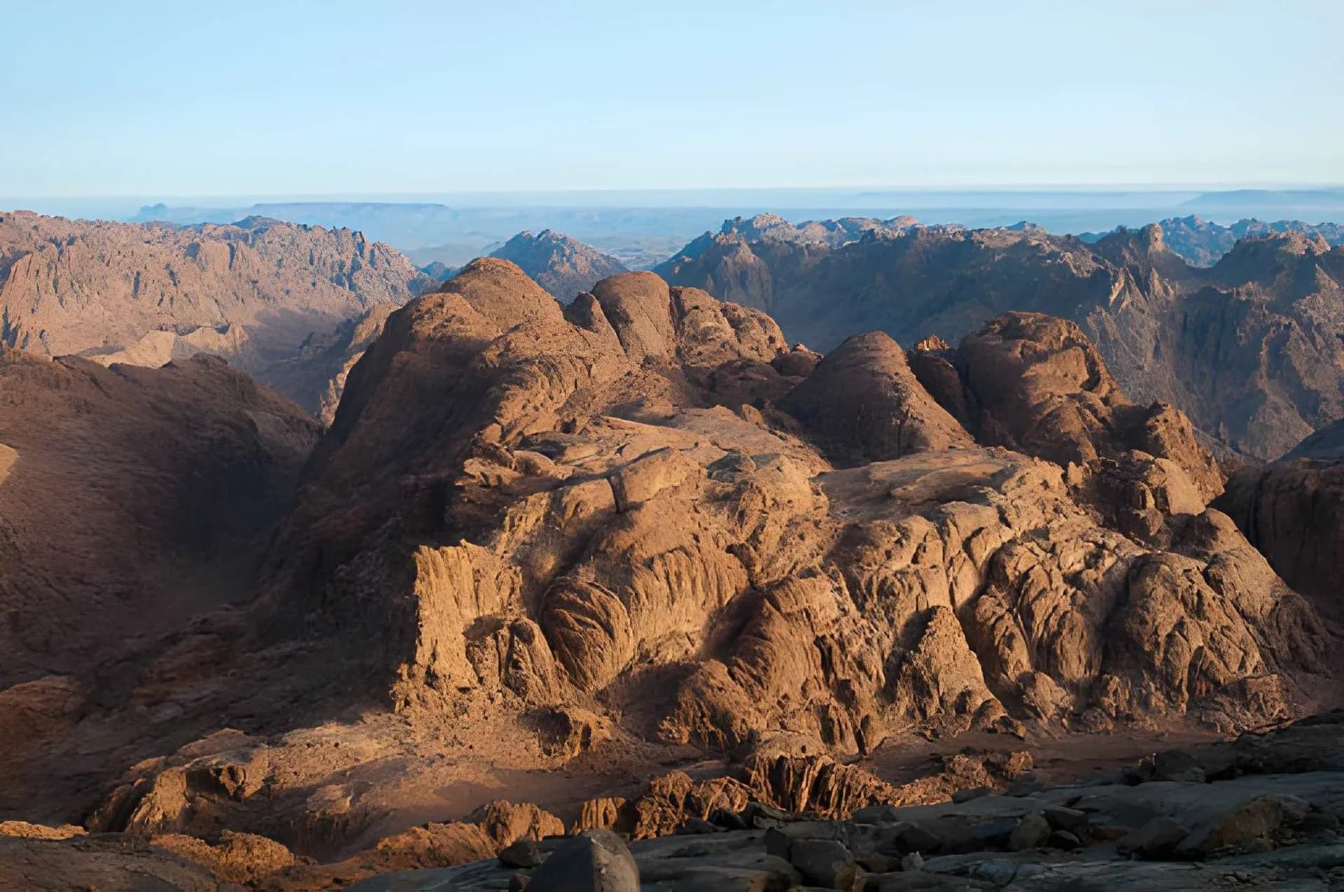 Sunlit granite mountains seen from Mount Sinai (Jebel Musa)