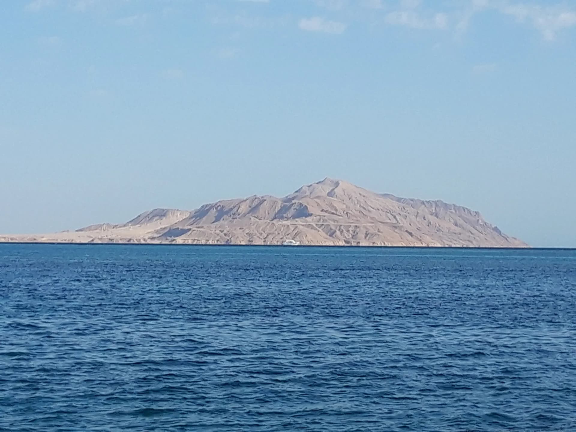 Tiran Island rising from the Red Sea, seen from the Sinai coast