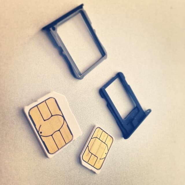 Micro and nano SIM cards with their trays