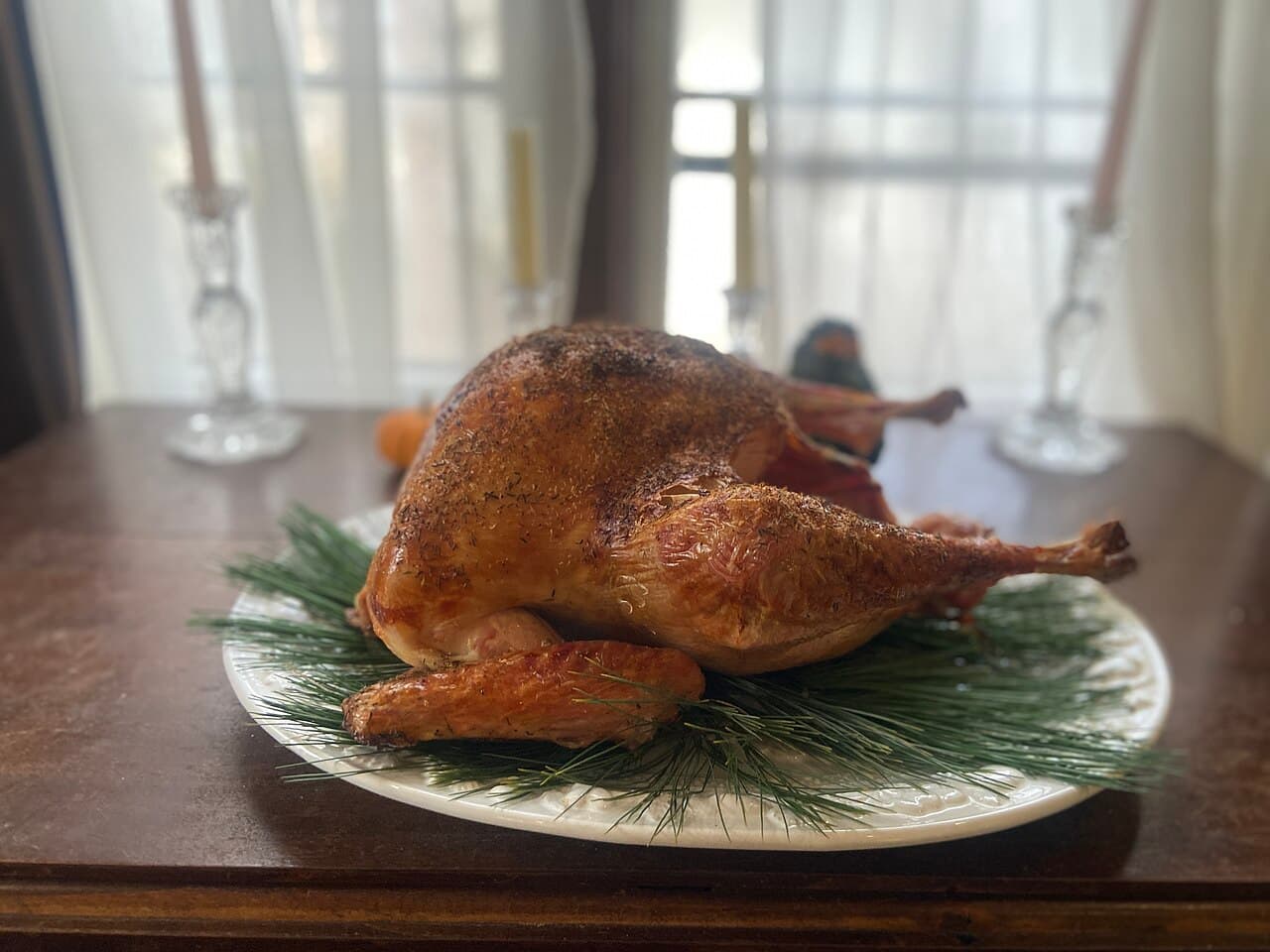 A roasted turkey on a holiday table
